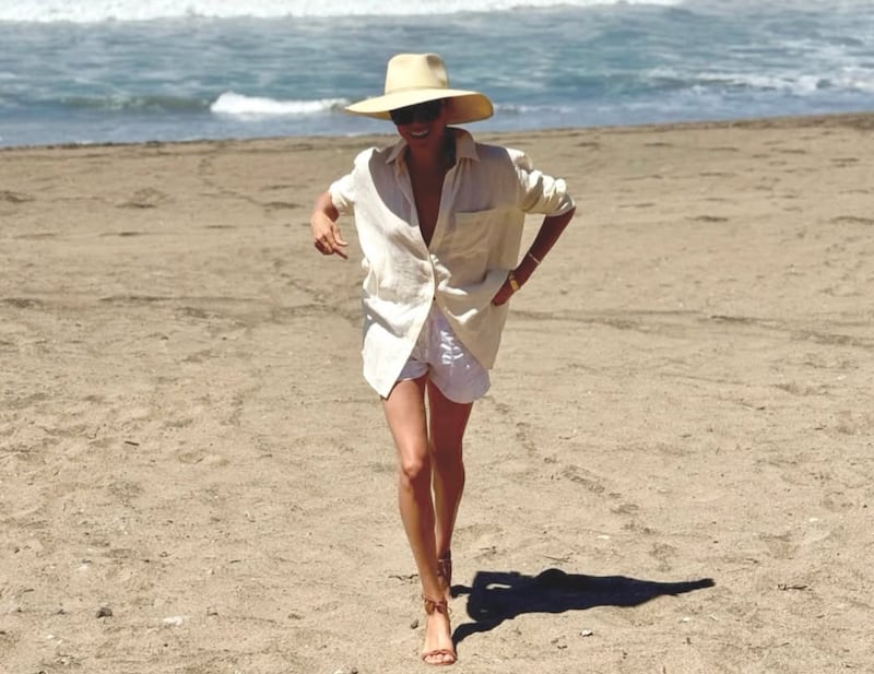 Meghan lives her best life on the beach