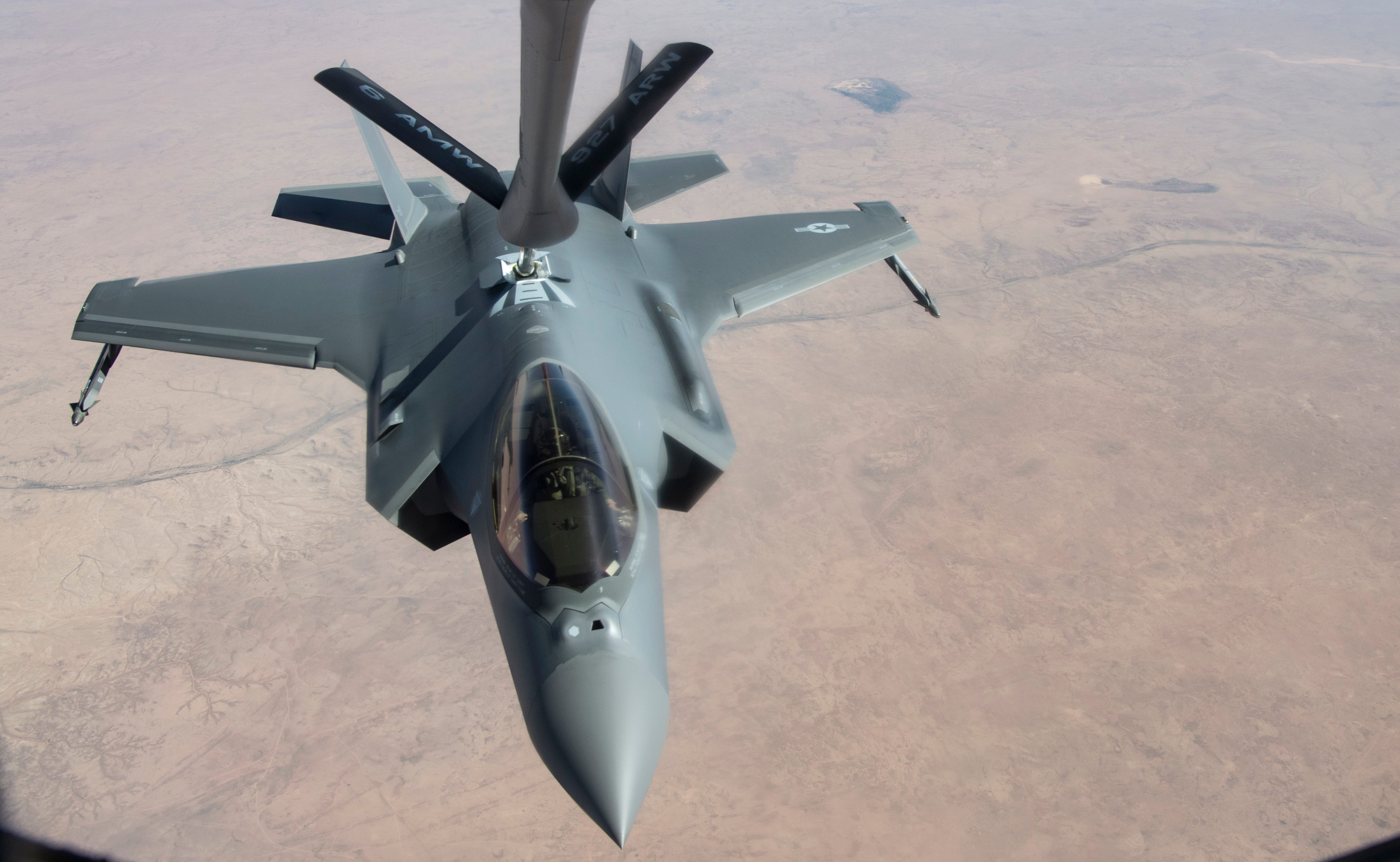 An Airman piloting an F-35A Lightning II completes aerial refueling courtesy of Airmen from the 28th Expeditionary Aerial Refueling Squadron aboard a KC-135R Stratotanker, April 26, 2019.