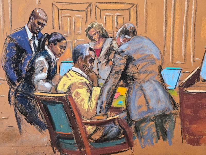 Defense attorneys discuss with Sean 