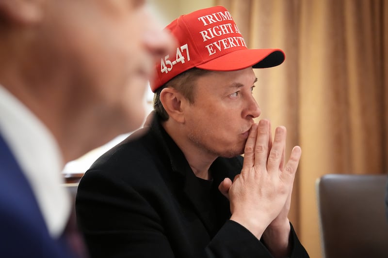Wearing a "TRUMP WAS RIGHT ABOUT EVERYTHING" baseball cap, Elon Musk listens during a cabinet meeting held by President Donald Trump at the White House on March 24, 2025 in Washington, D.C.