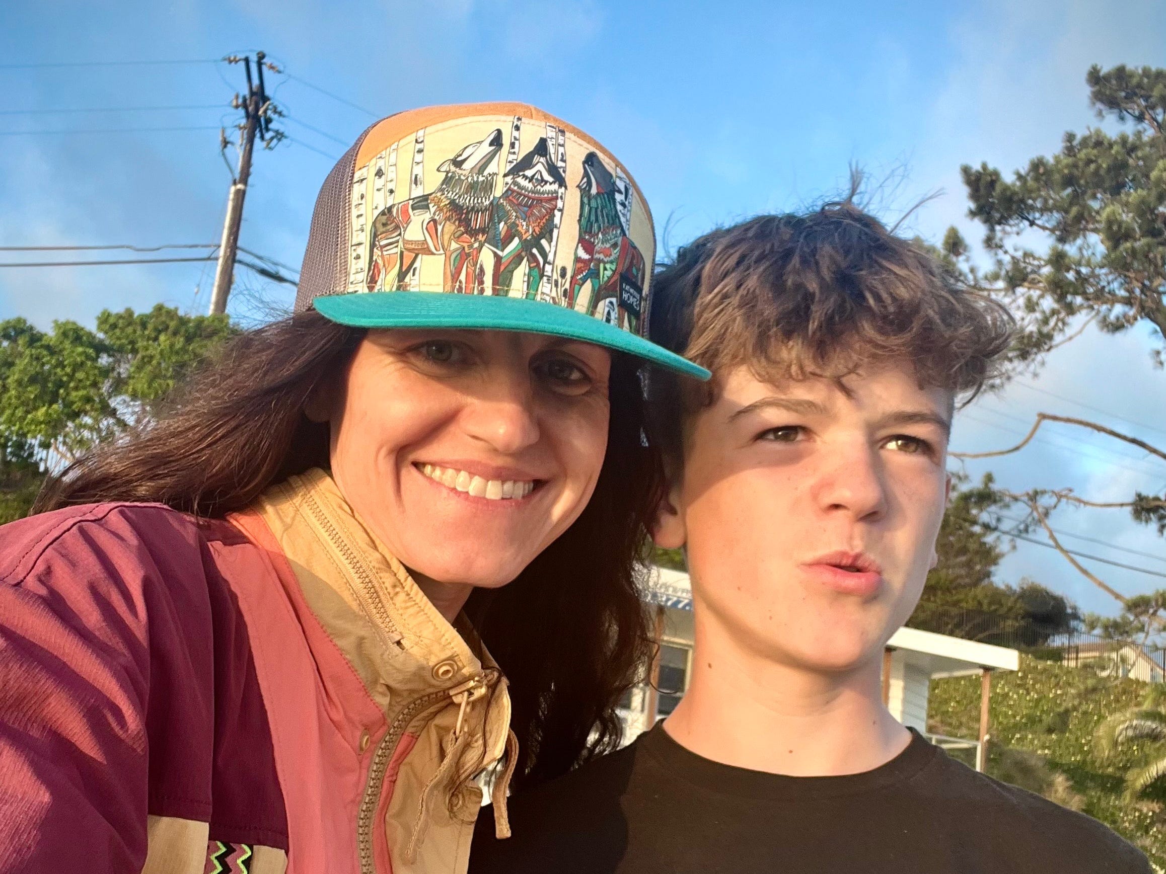 The author with her son standing outside in the sun.