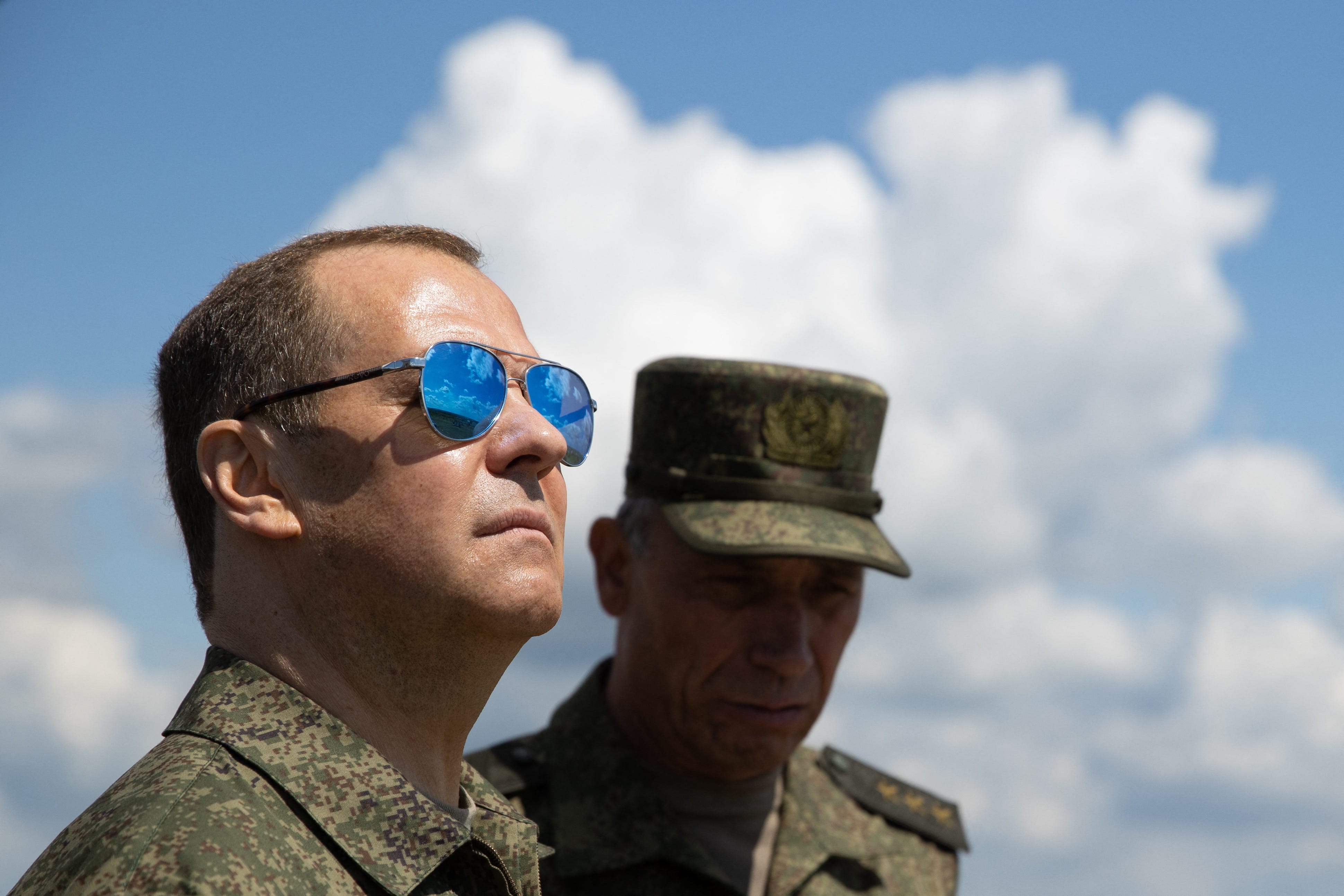 Russia's former president and now serving as deputy chairman of the country's Security Council, Dmitry Medvedev (L), visits the Totsky military training field outside Siberian city of Orenburg on July 14, 2023.