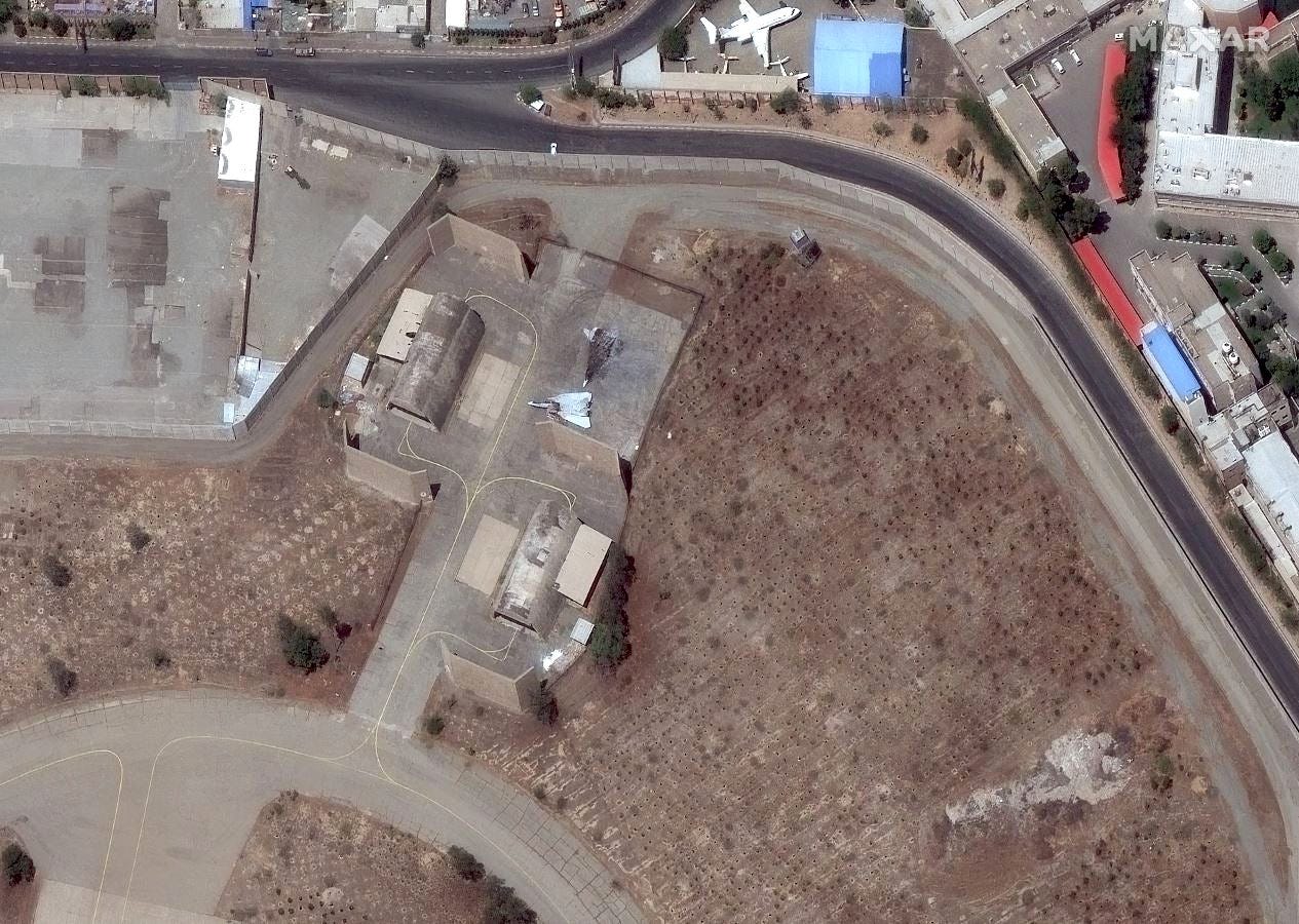 A June 20, 2025, image shows destroyed F-14s at Tehran's Mehrabad airport.