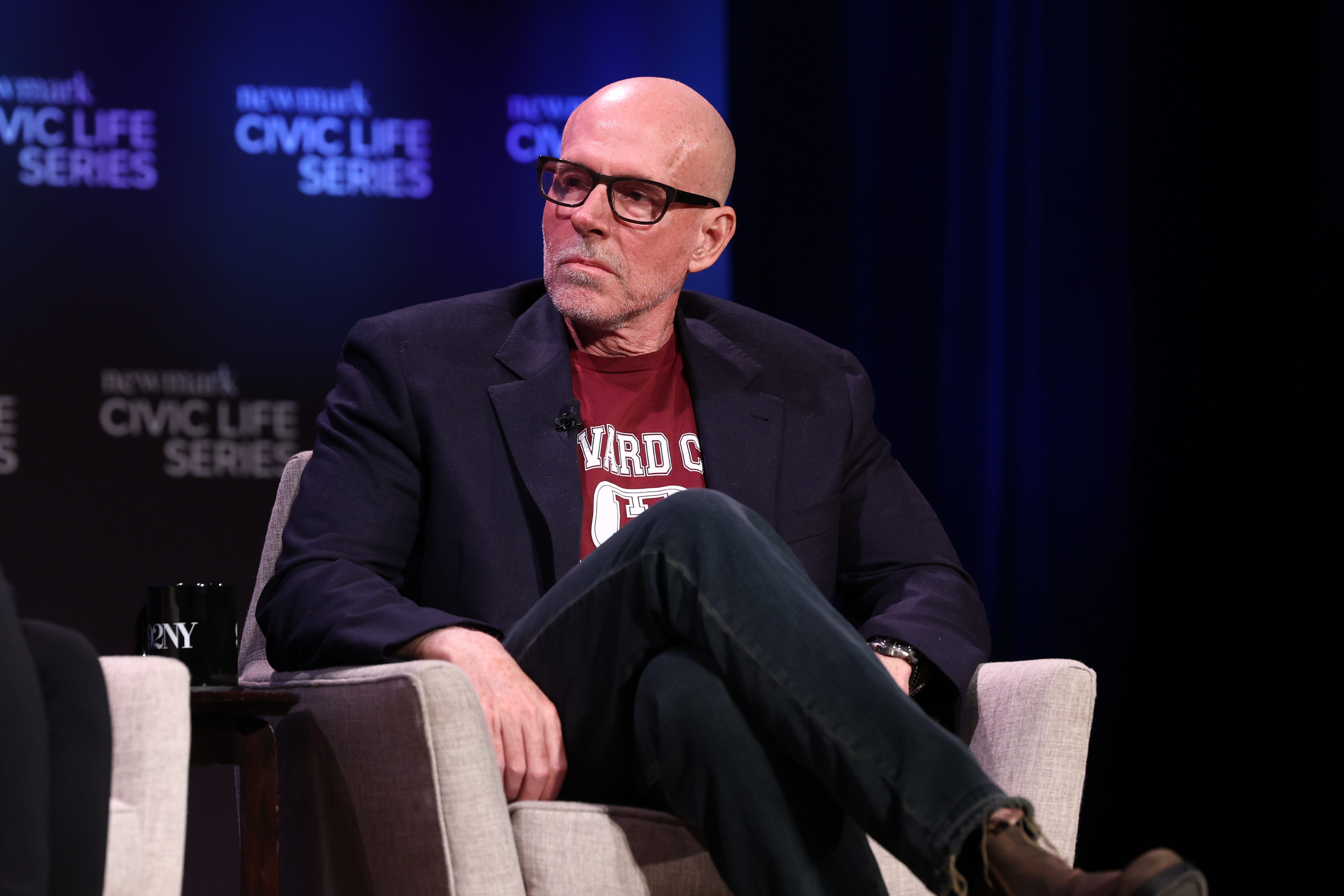 NYU professor Scott Galloway on stage at a panel discussion.