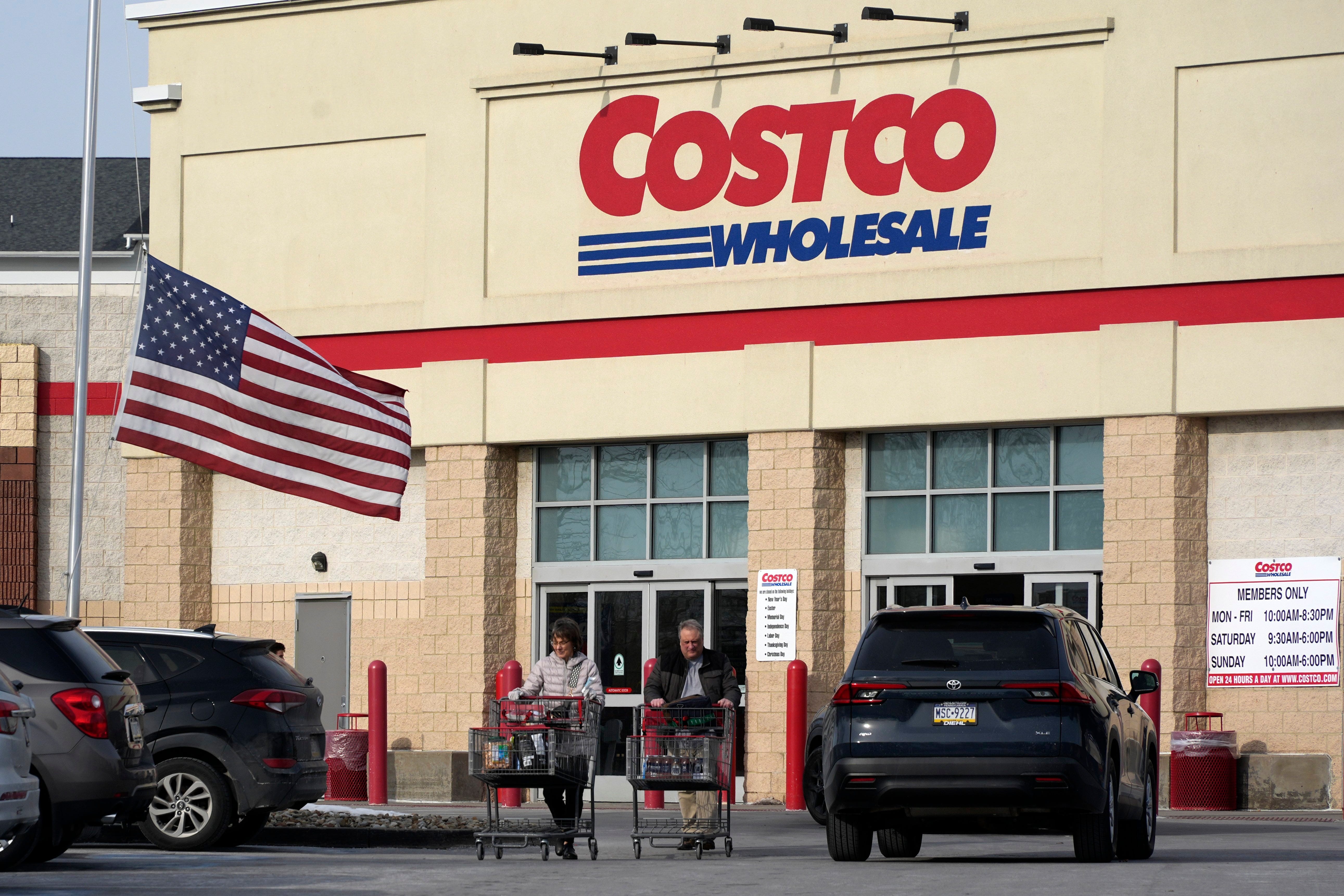Shoppers exit a Costco Warehouse in Cranberry, Pa