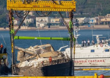 Superyacht is pulled from the seabed 10 months after sinking off Sicily