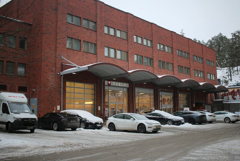 A view of cars outside of a Tesla service centre as workers picket, in Upplands Vasby, north of Stockholm, Sweden.