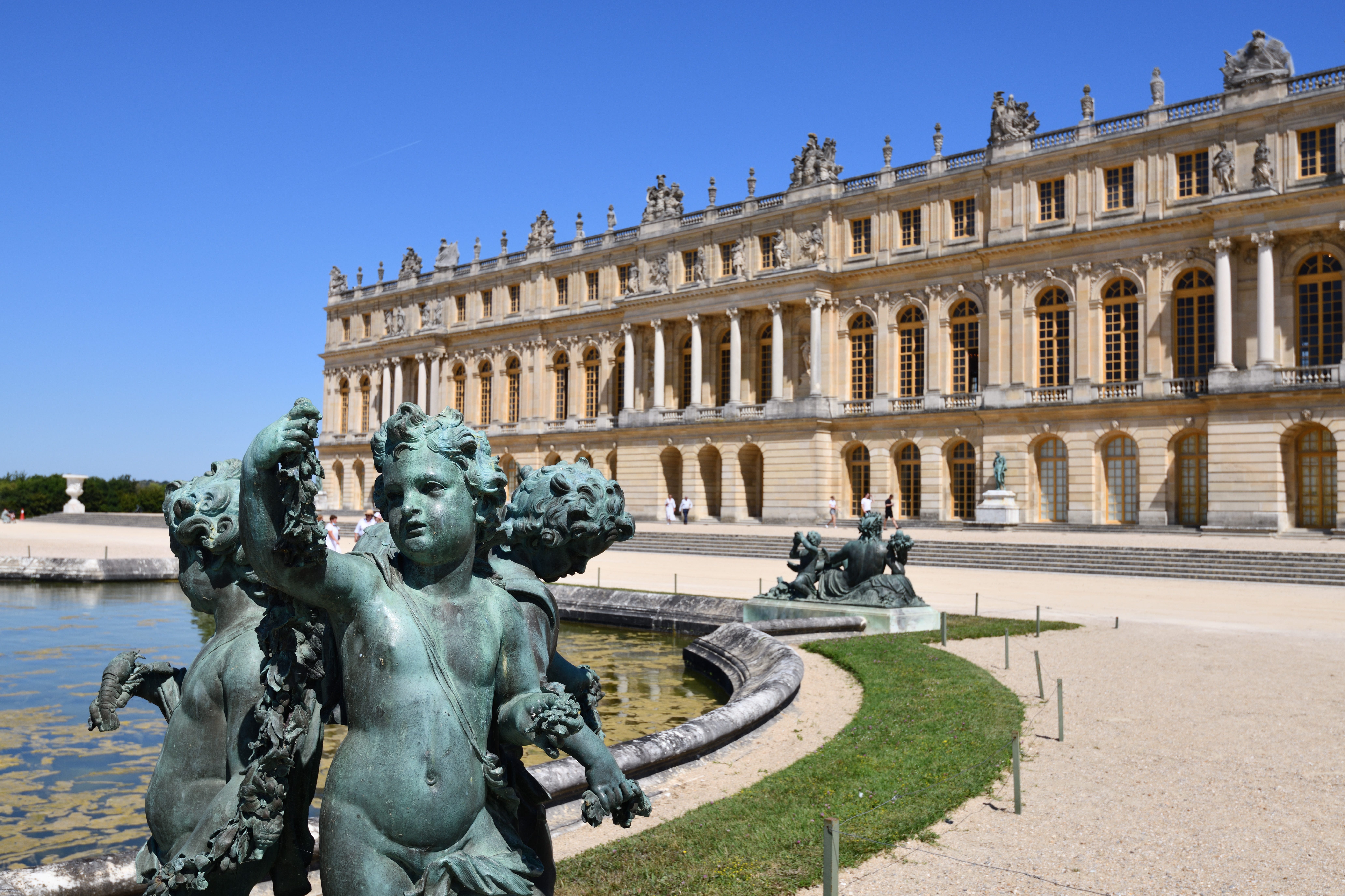 Water basin called Parterre d'eau with the palace of Versailles in the background, île de France, (Unesco World Heritage List, 1979) on June 23, 2020 in Paris, France.