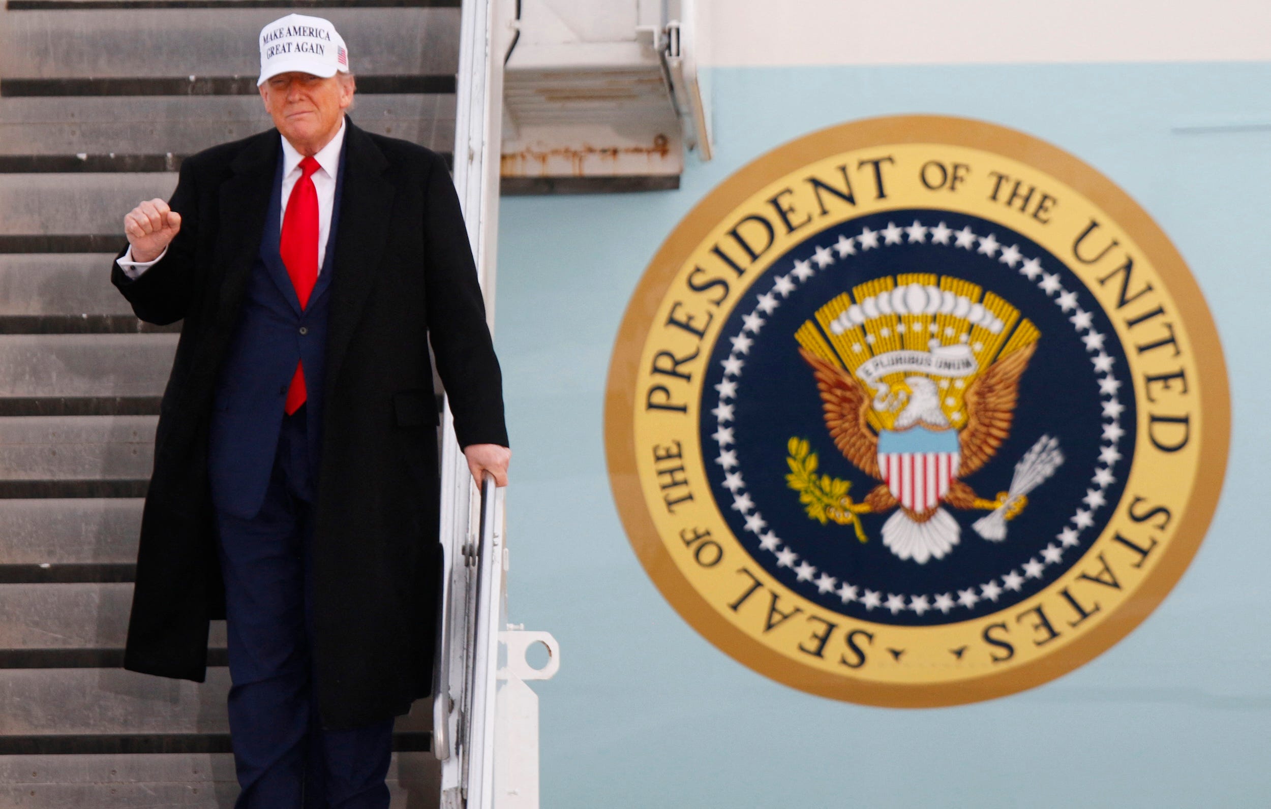 Donald Trump walks down the stairs of Air Force One upon arriving in Canada for a G7 meeting