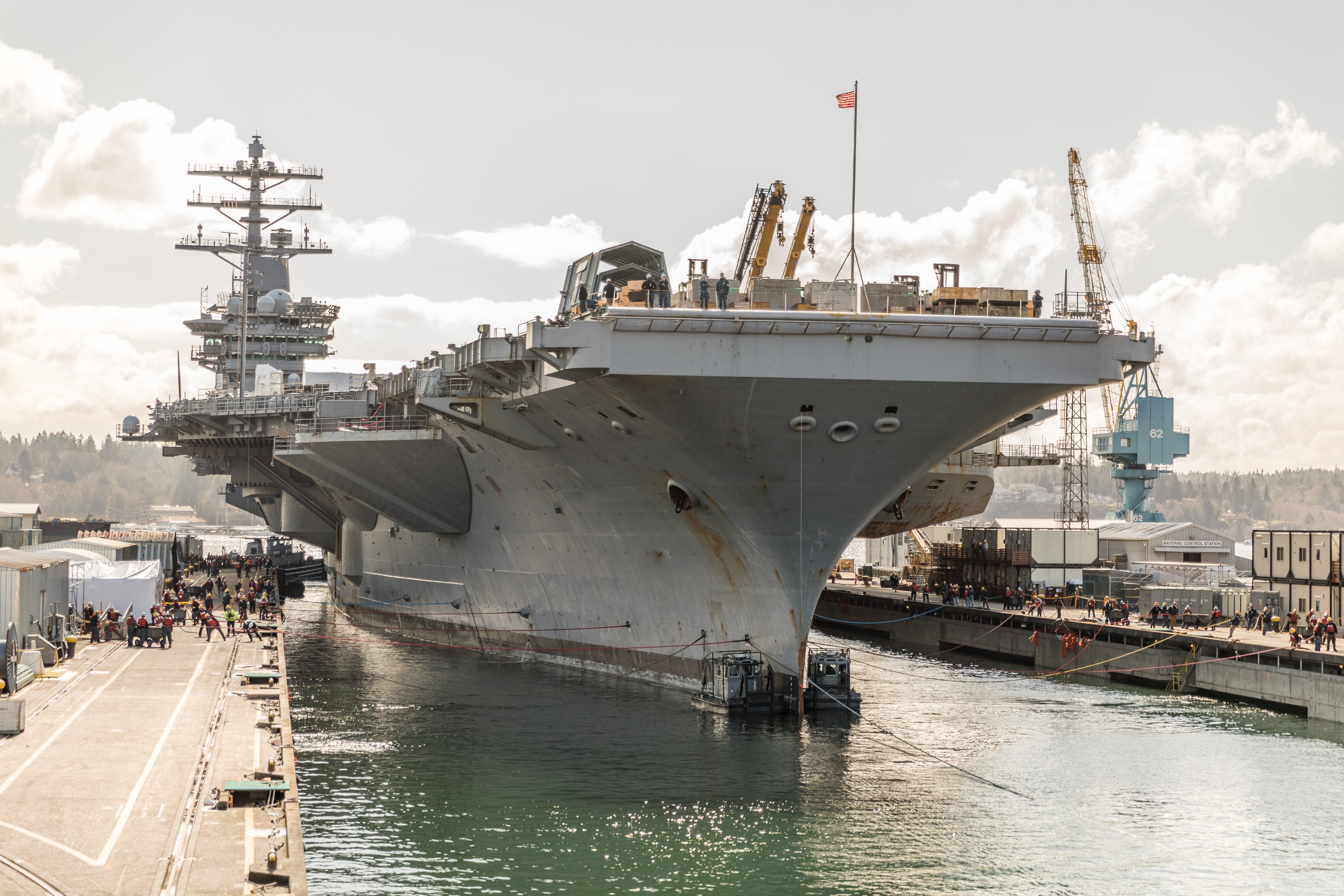 The aircraft carrier USS Nimitz sits in a dry dock at the Puget Sound Naval Shipyard.