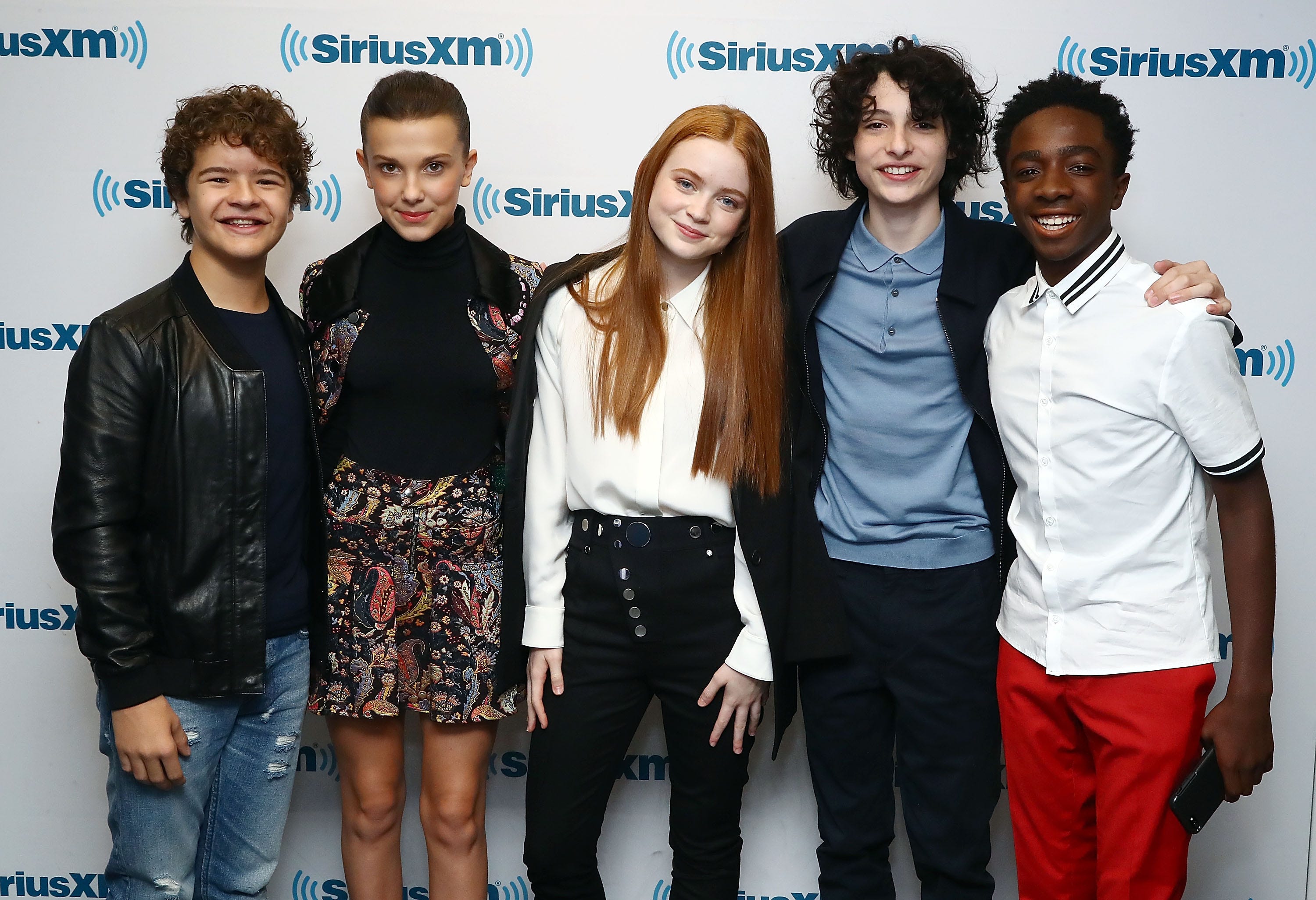 Actors Gaten Matarazzo, Millie Bobby Brown, Sadie Sink, Finn Wolfhard and Caleb McLaughlin attend SiriusXM's 'Town Hall' cast of Stranger Things on SiriusXM's Entertainment Weekly Radio on November 1, 2017