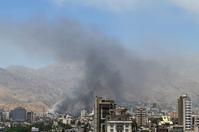 Smoke rises from strike site north of Tehran that was hit by Israel on Monday/