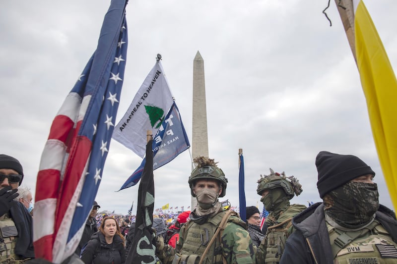 A "Stop the Steal" protester carries the "An Appeal to Heaven" flag on Jan. 6, 2021.