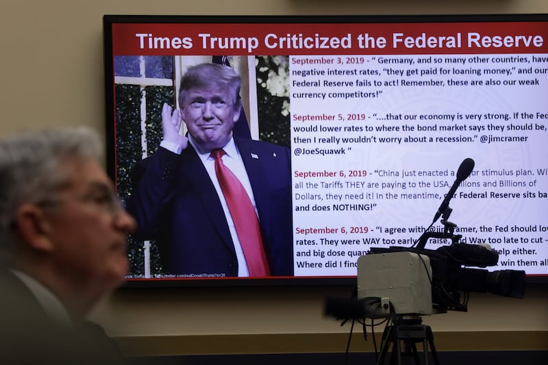 Federal Reserve Board Chairman Jerome Powell testifies as a photo of U.S. President Donald Trump is shown on a screen during a hearing before House Financial Services Committee February 11, 2020 on Capitol Hill in Washington,