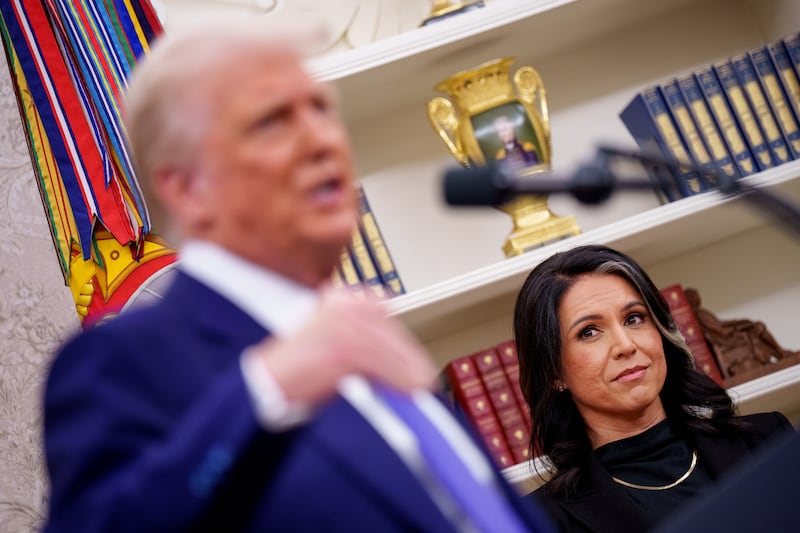 President Donald Trump, accompanied by Tulsi Gabbard, speaks after Gabbard is sworn in as director of national intelligence in the Oval Office at the White House