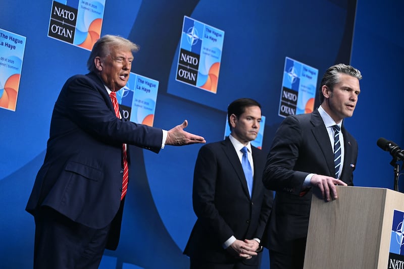 President Donald Trump gesturing to Defense Secretary Pete Hegseth at a press conference during a NATO summit on June 25, 2025 here he floated calling him secretary of war.