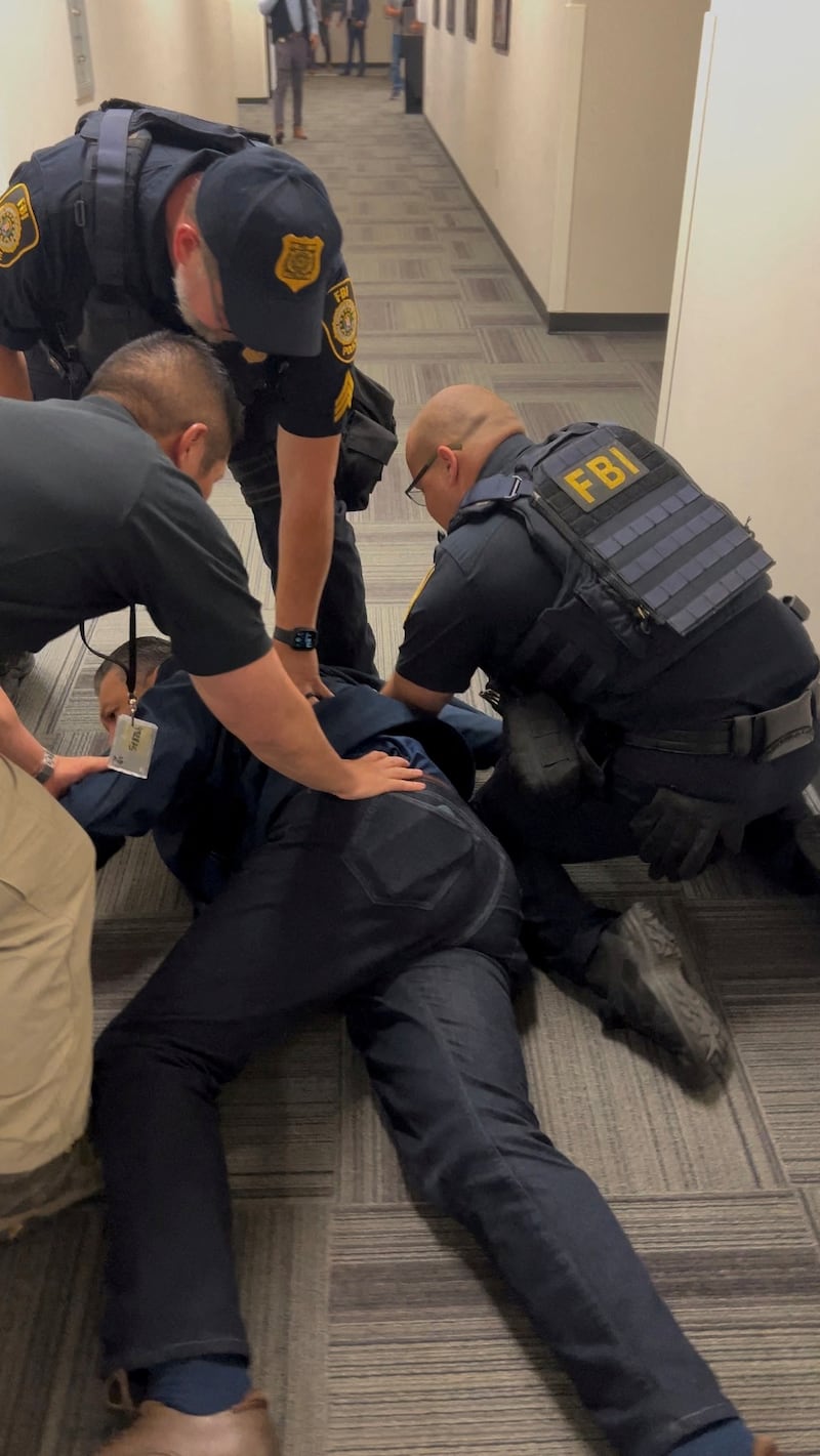 U.S. Senator Alex Padilla (D-CA) is held down on the floor before being handcuffed by security officers after he attempted to ask a question during U.S. Homeland Security Secretary Kristi Noem's press conference, in Los Angeles, California, U.S., June 12, 2025, in this still image obtained from a video. Office of the Senator Alex Padilla