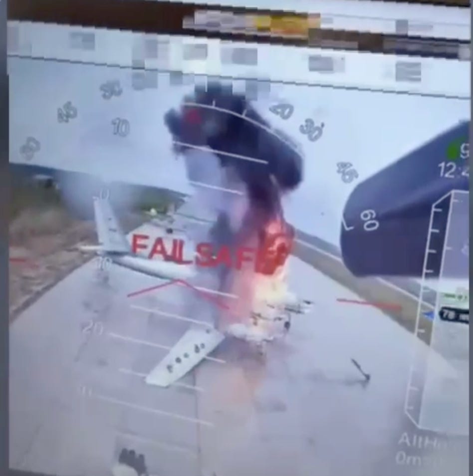 A screengrab shows a Ukrainian drone strike on a Russian bomber aircraft.