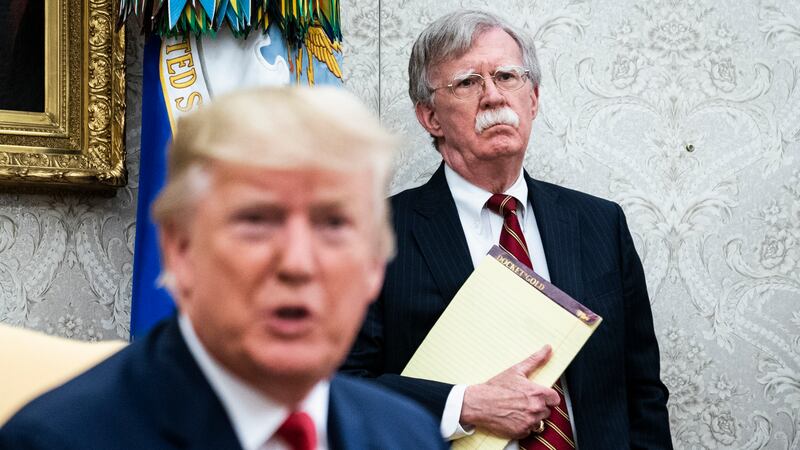 WASHINGTON, DC - JULY 18 : National Security Advisor John R. Bolton listens as President Donald J. Trump meets with Prime Minister of the Netherlands Mark Rutte in the Oval Office at the White House on Thursday, July 18th, 2019 in Washington, DC. (Photo by Jabin Botsford/The Washington Post via Getty Images)