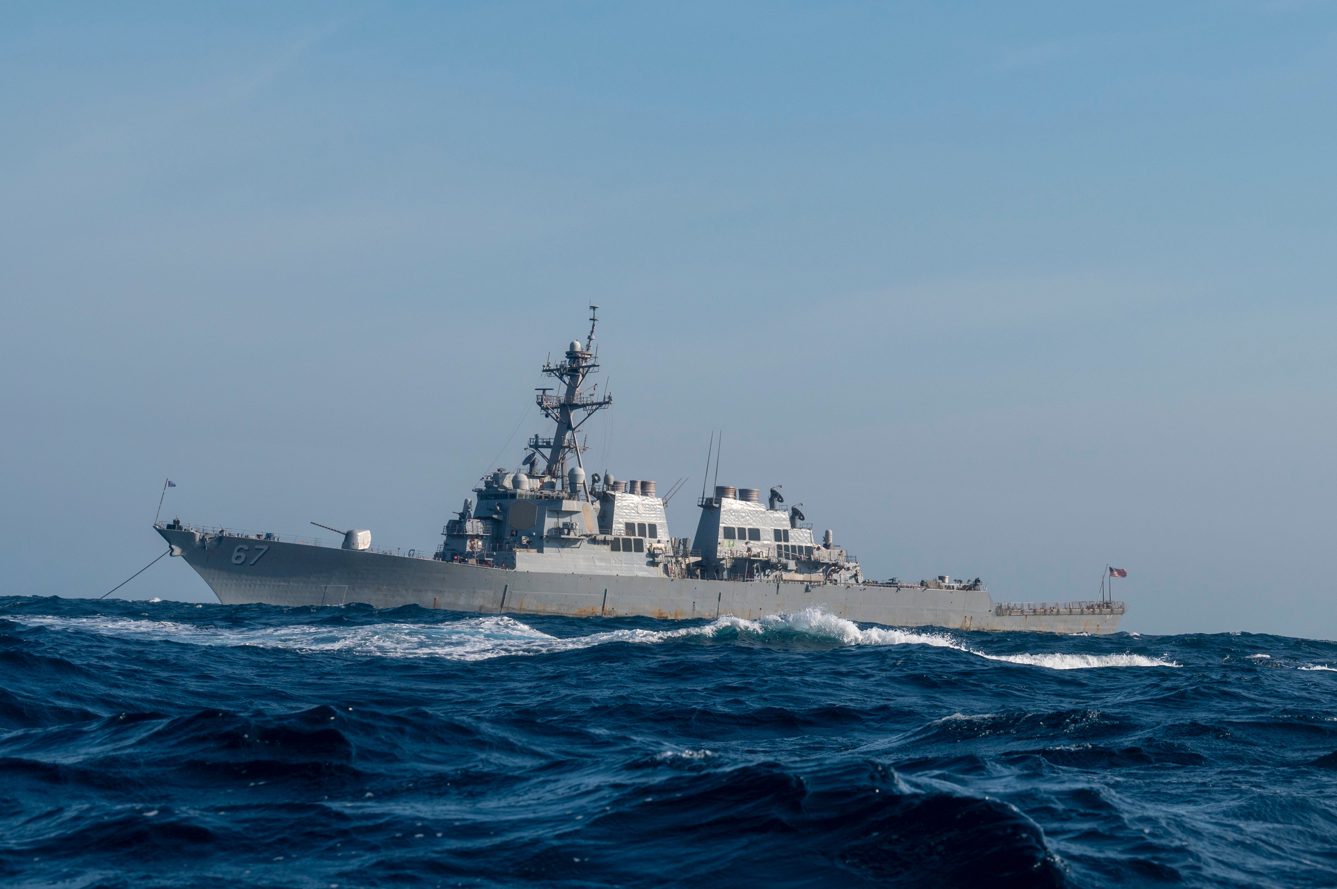 Arleigh Burke-class guided missile destroyer USS Cole (DDG-67) moors off the coast of Charleston, South Carolina, April 15, 2025.
