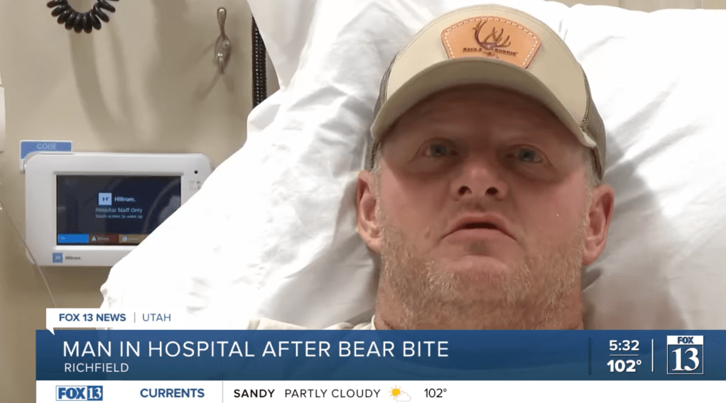 Nate Peterson sits in his hospital bed after the bear attack in Bryce Woodlands,Utah.