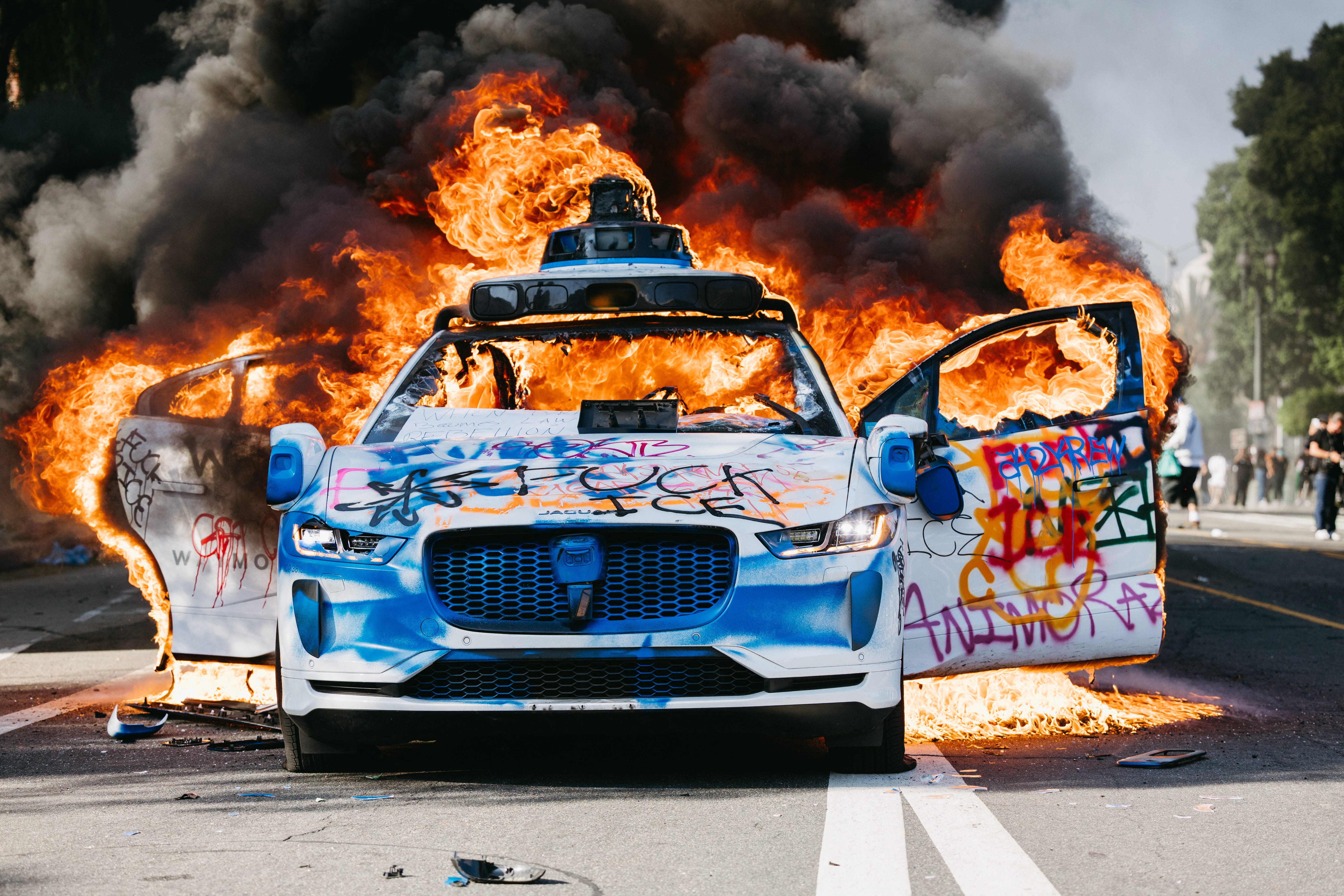 Waymo robotaxi fire LA protests