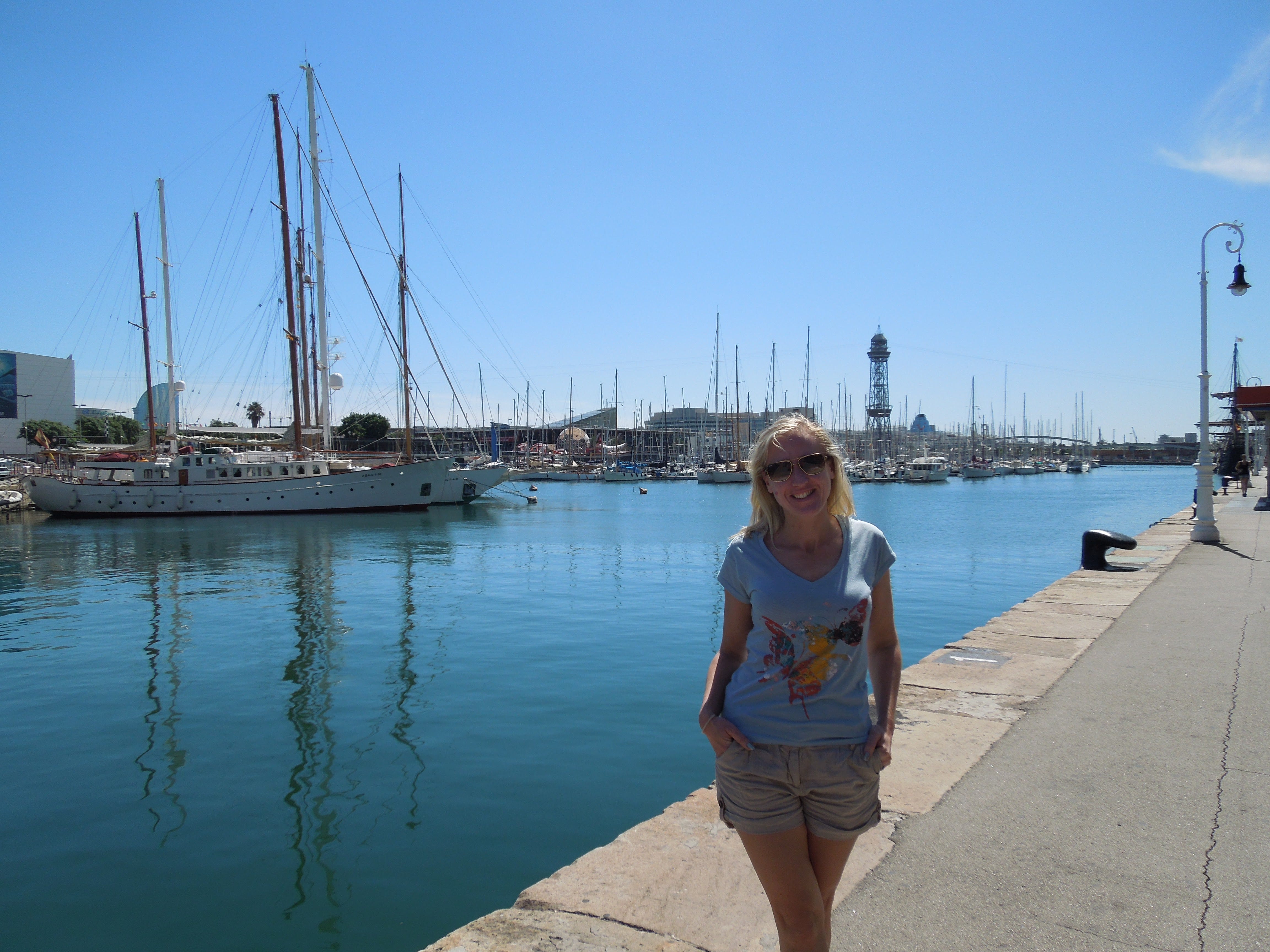 Author Louise Slyth smiling next to body of water