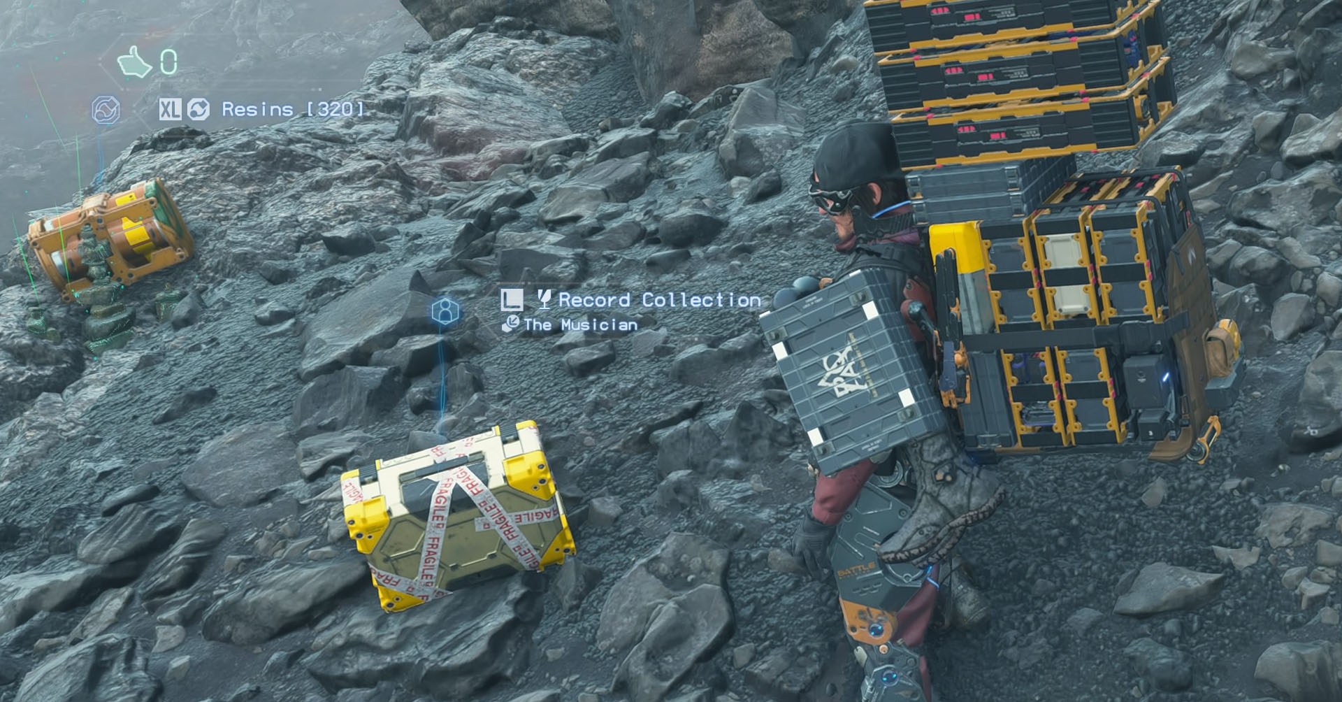 A Death Stranding 2 screenshot showing the main character Sam Porter in front of the a box indicated as “Record Collection”.