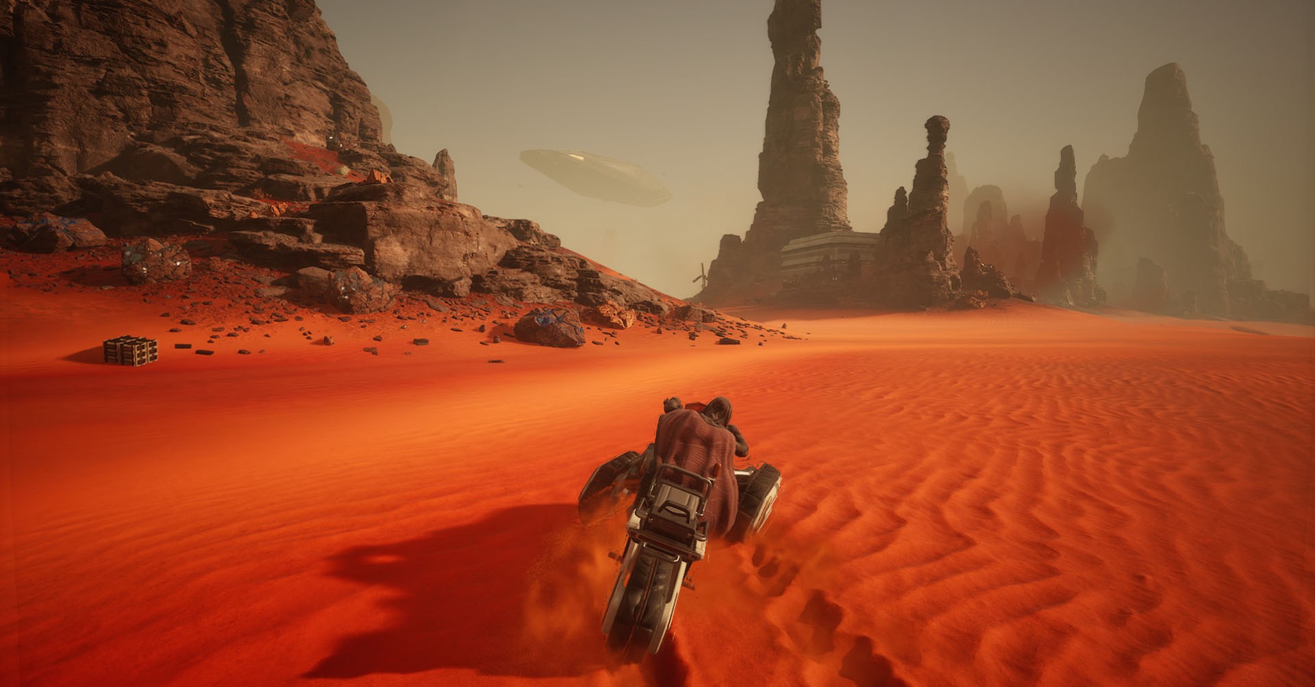 A Dune: Awakening screenshot showing a character riding a bike in Arrakis