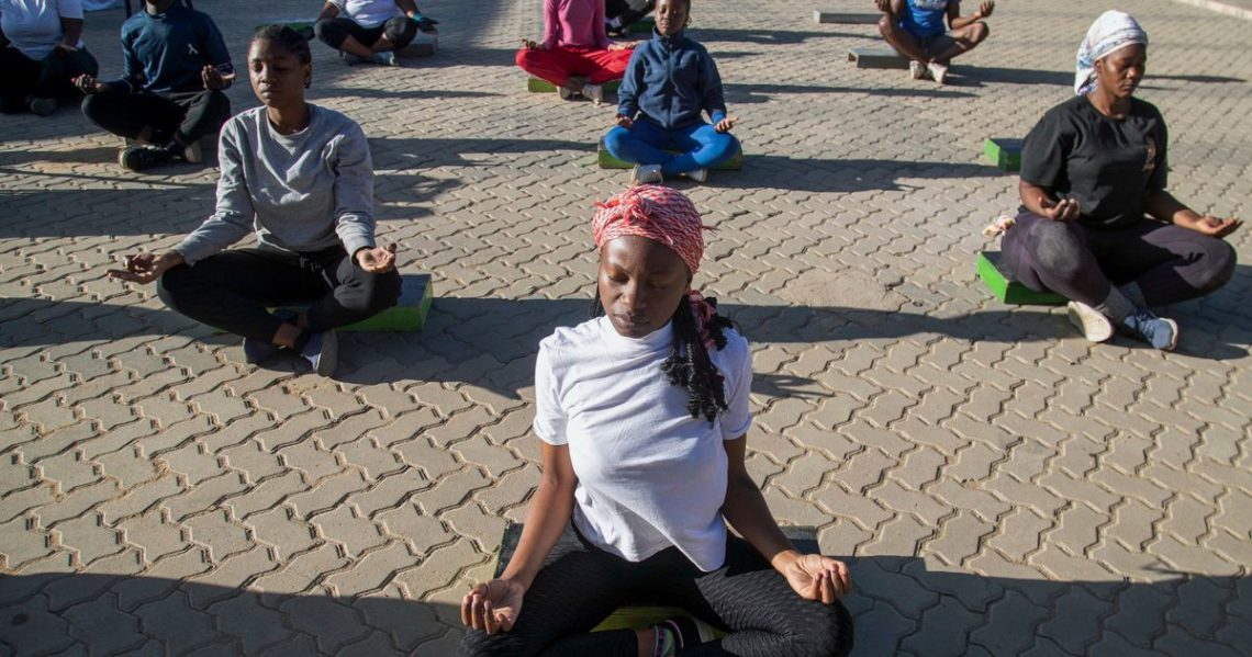 Yoga in a Zimbabwe tavern is the latest mental health outreach in a struggling country