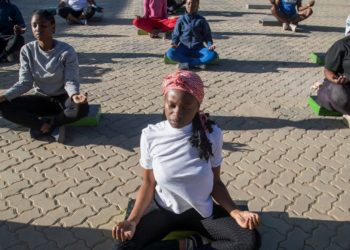 Yoga in a Zimbabwe tavern is the latest mental health outreach in a struggling country