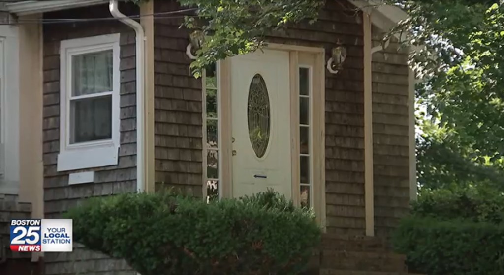Exterior of a house with a white door.
