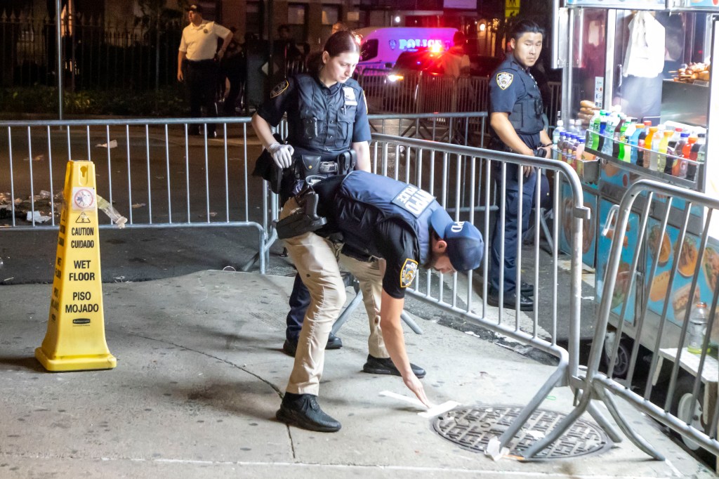 Police officers collecting evidence at a crime scene.