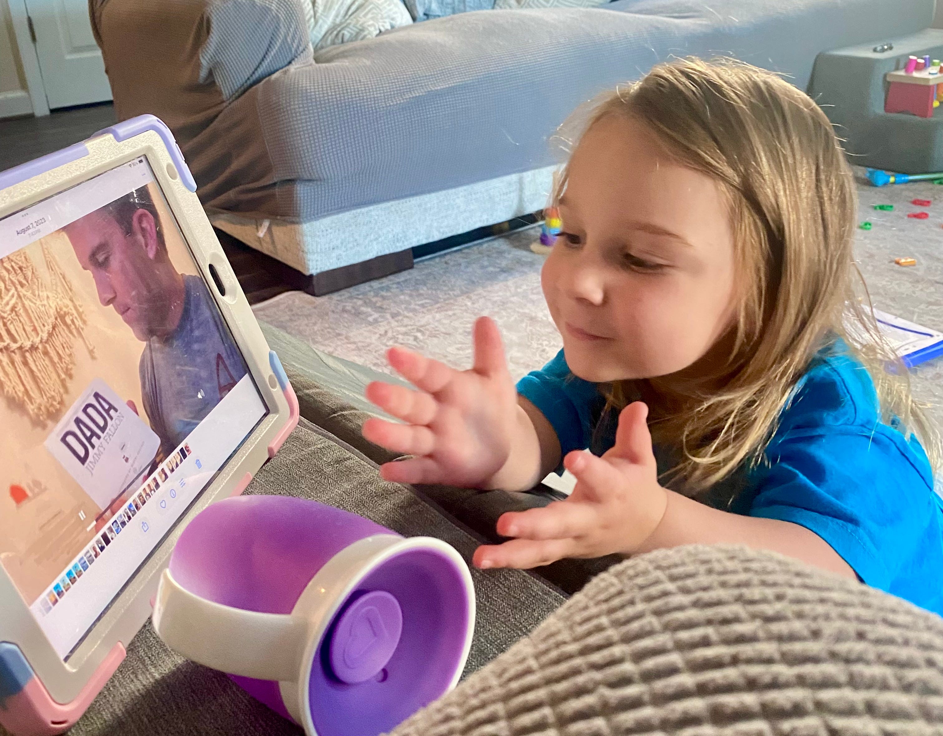 Lauren Gumpert's daughter watching a video of her father