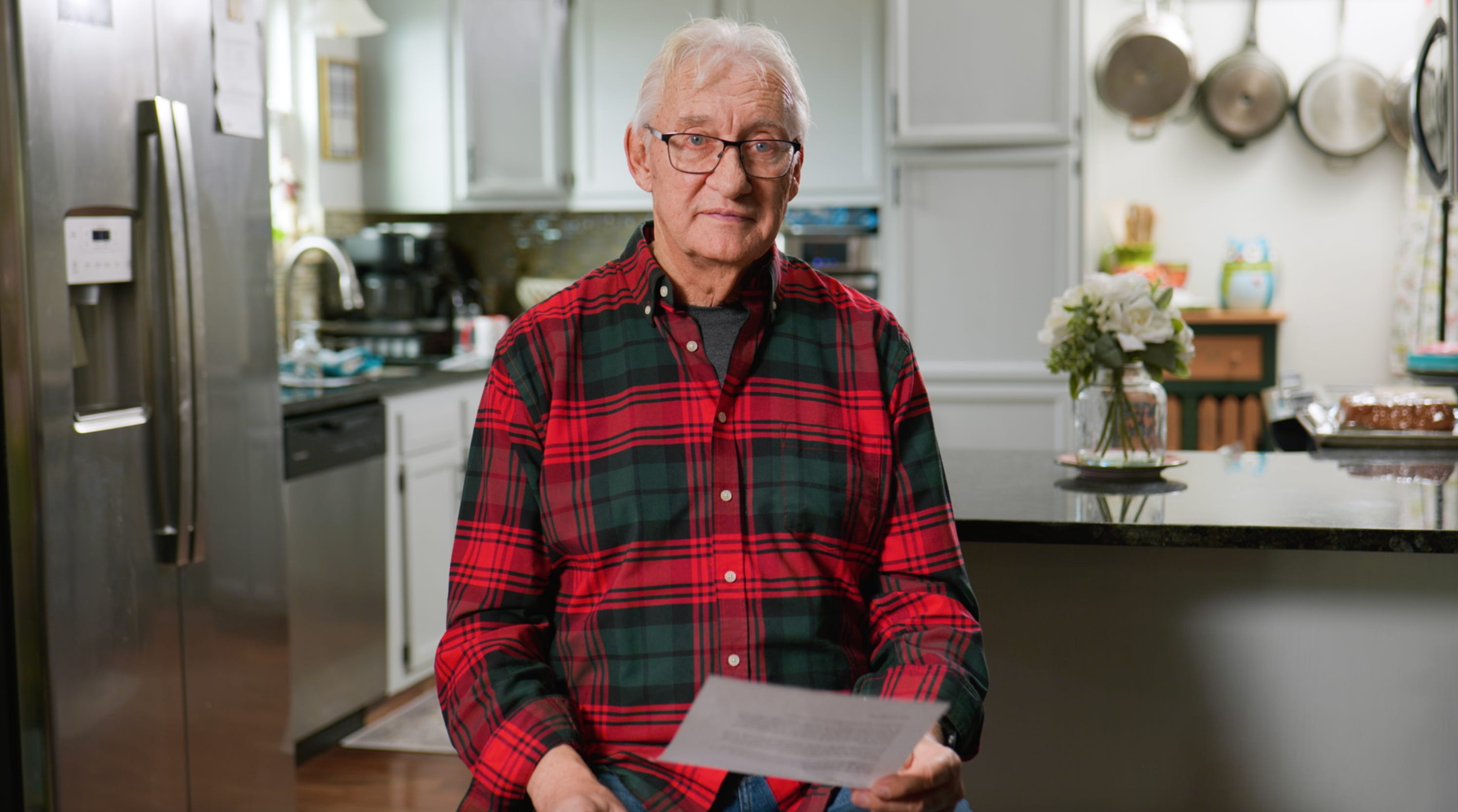 Hank Faber sitting in his kitchen