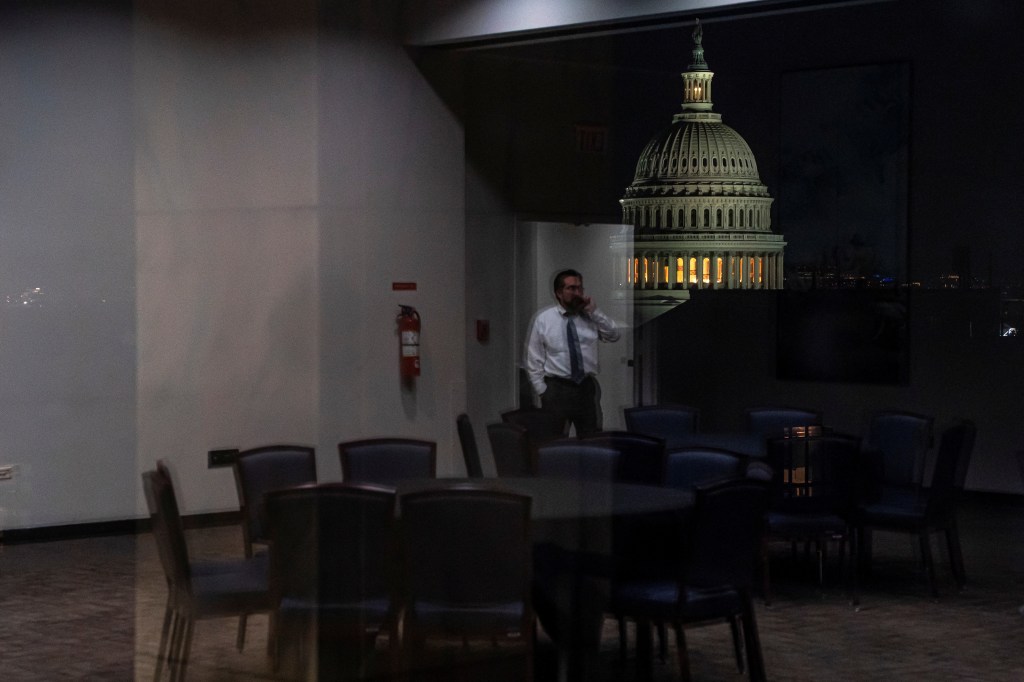 A Senate staffer talks on the phone in the Hart Senate Office Building as Republican lawmakers struggle to pass U.S. President Donald Trump's sweeping spending and tax bill, on Capitol Hill in Washington, D.C., U.S., June 30, 2025. 