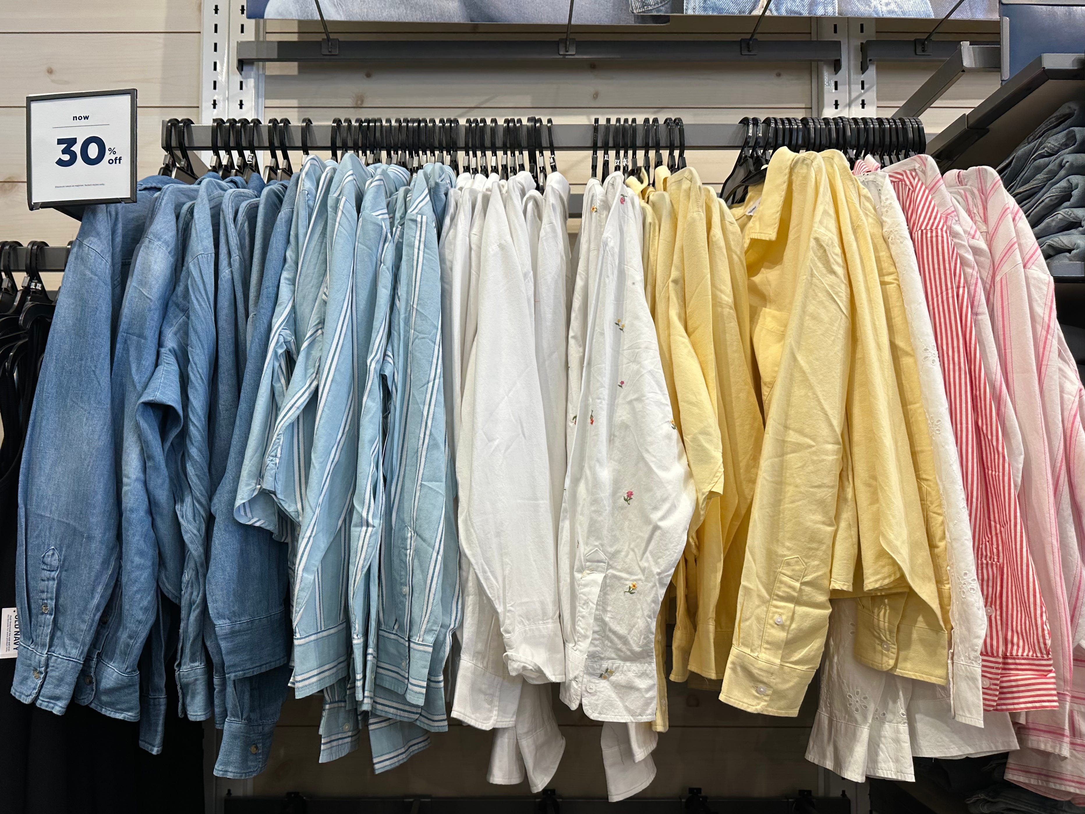 Colorful button-up shirt options on the rack at Old Navy.