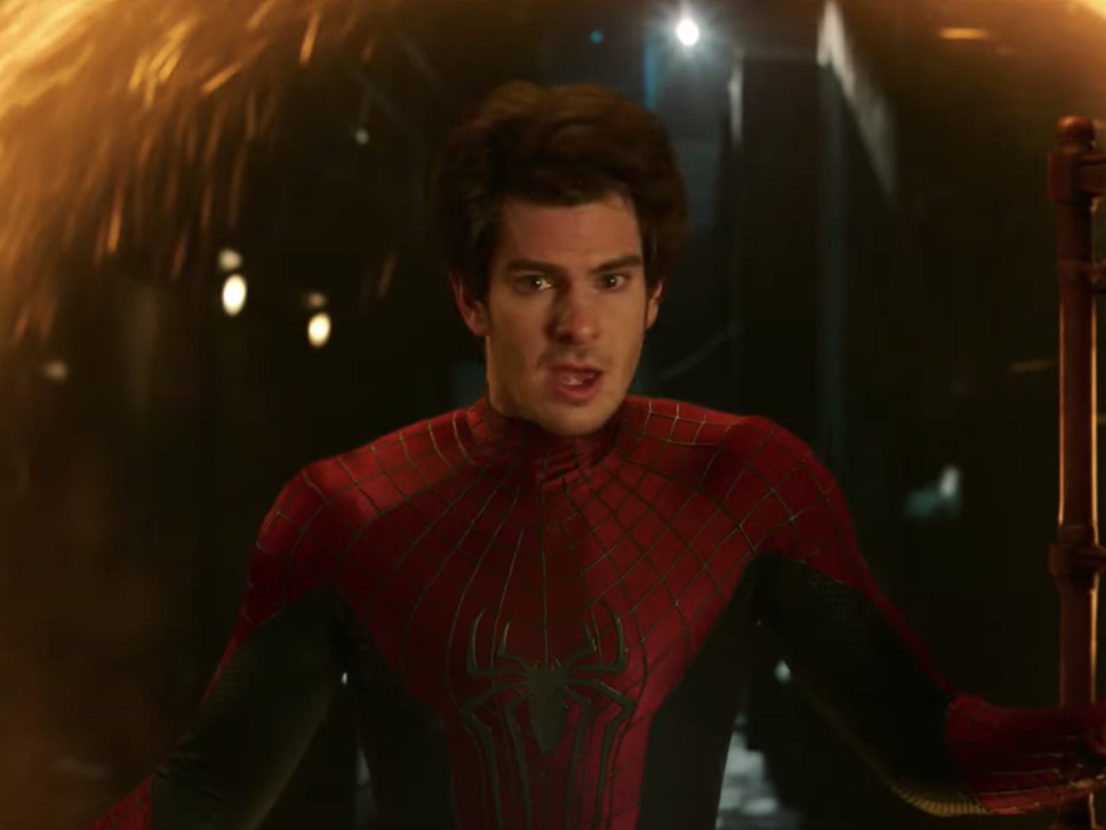 Andrew Garfield's version of Spider-Man emerging from a portal in 