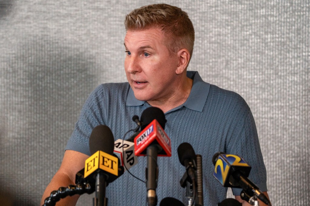 Todd Chrisley speaking at a press conference.