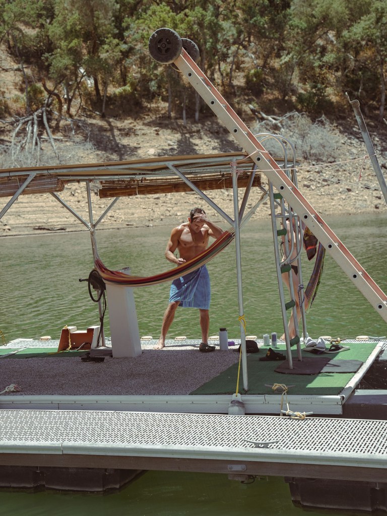 Shirtless Zac Efron dries off.