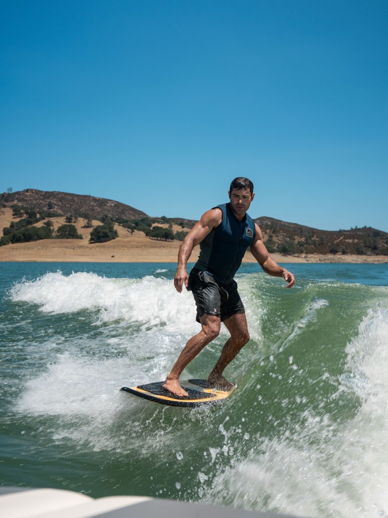  Zac Efron on a water board.