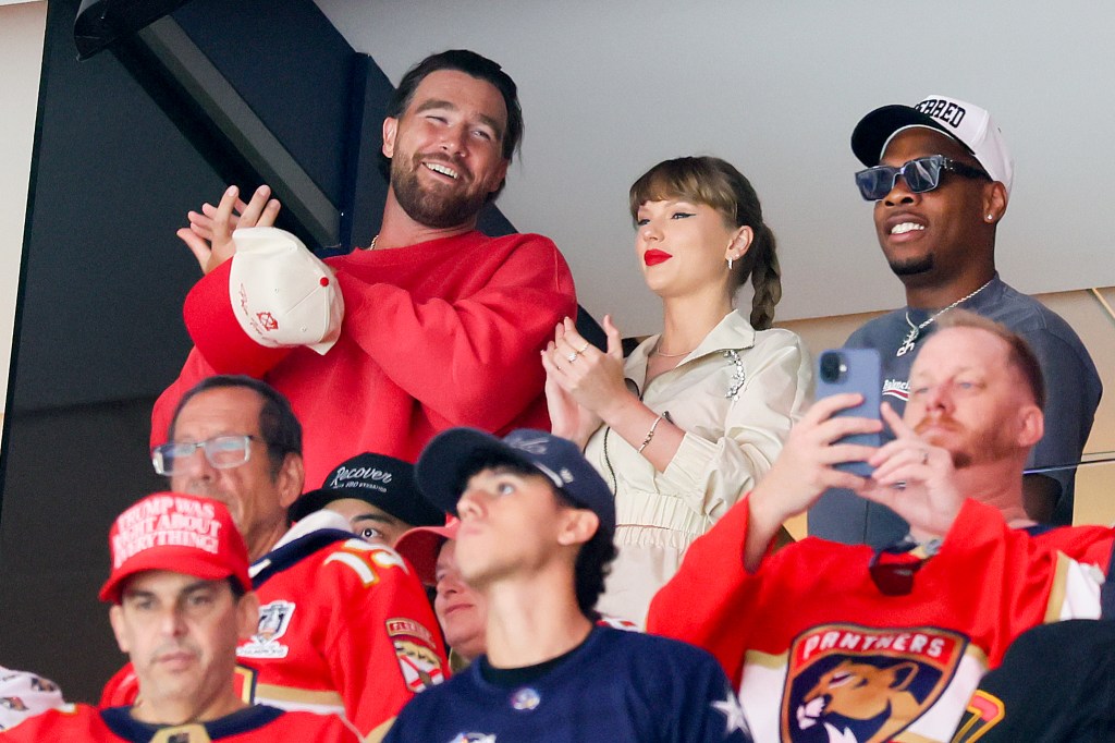 Travis Kelce, left, and Taylor Swift react as the Edmonton Oilers and the Florida Panthers play during the first period in Game Four of the 2025 Stanley Cup Final at Amerant Bank Arena on June 12, 2025 in Sunrise, Florida. 