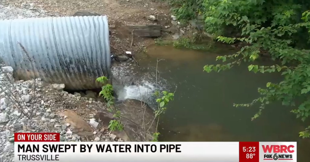 Man swept into drainage pipe by floodwaters.