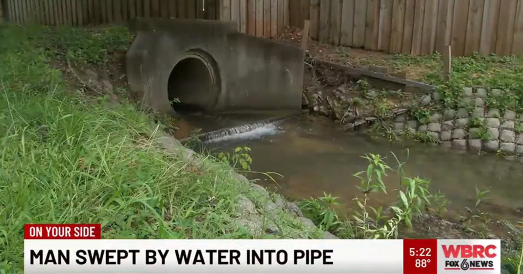 Man swept into drainage pipe by floodwater.
