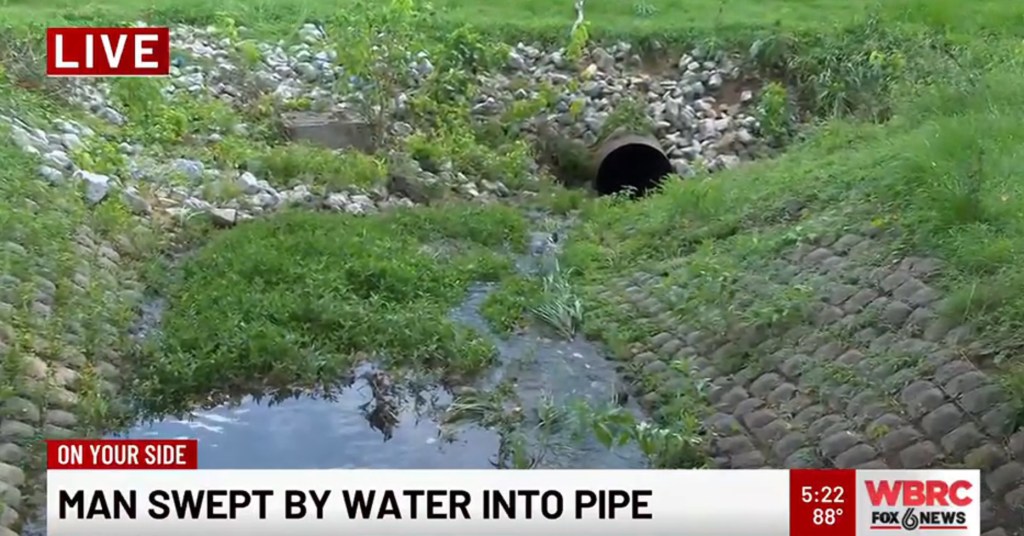 Man swept into drainage pipe by floodwaters.