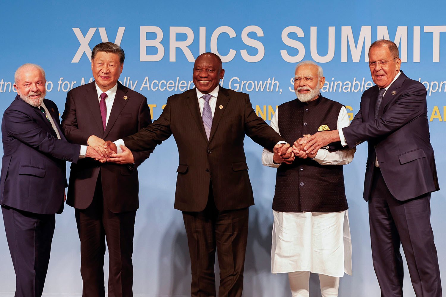 From left to right: President of Brazil Luiz Inacio Lula da Silva, President of China Xi Jinping, South African President Cyril Ramaphosa, Prime Minister of India Narendra Modi and Russia's Foreign Minister Sergei Lavrov pose for a BRICS family photo during the 2023 BRICS Summit in Johannesburg on Aug. 23, 2023.