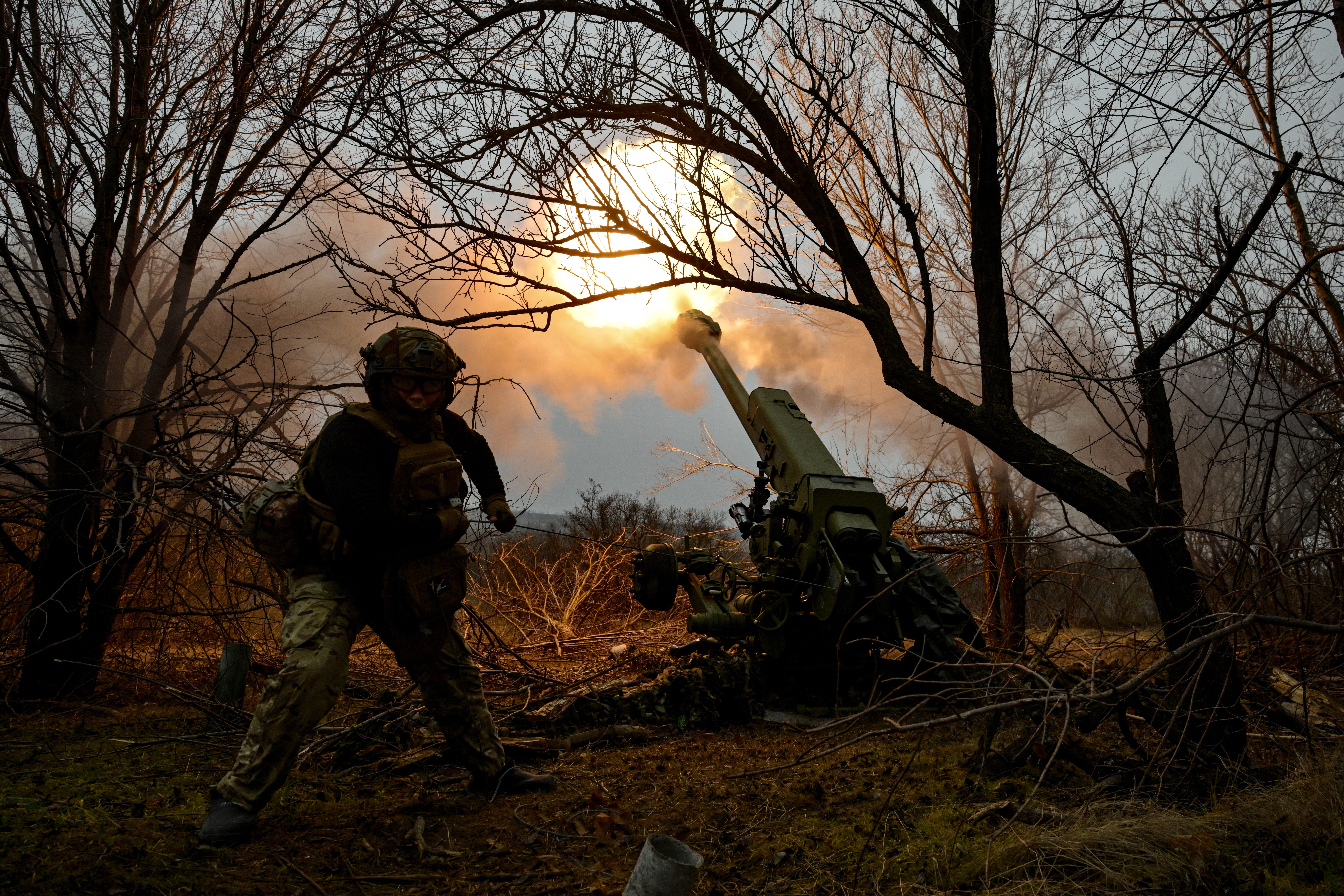A Ukrainian soldier fires a 122-mm howitzer at Russian positions in the Zaporizhzhia region in January.