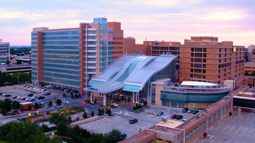 Aerial view of a hospital complex at sunset.