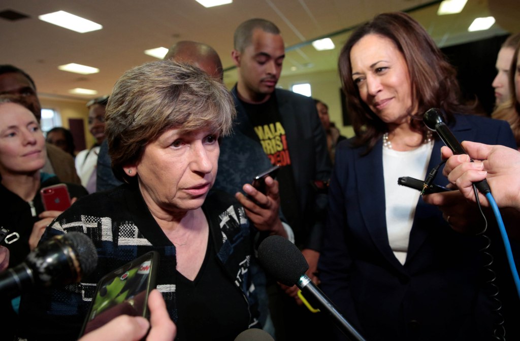 Sen. Kamala Harris looks on as Randi Weingarten speaks to reporters in Detroit, Michigan on May 6, 2019.
