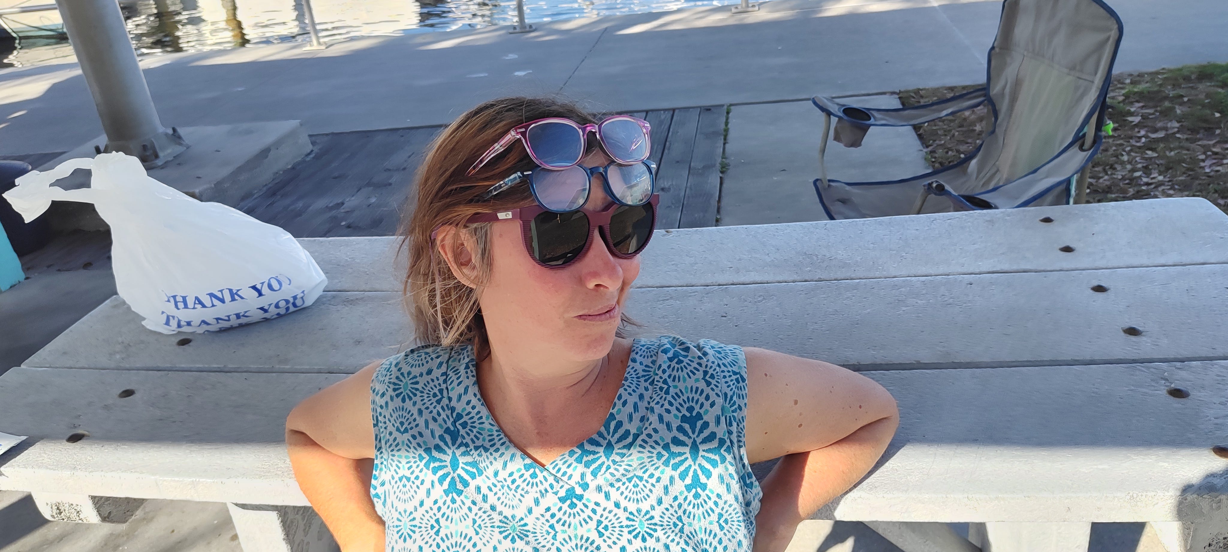 Lara Manetta wearing a blue shirt and sunglasses